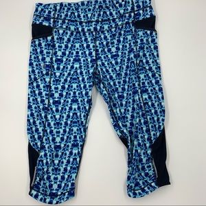 Athleta Cropped Leggings with Mesh and side pockets, Size Large
